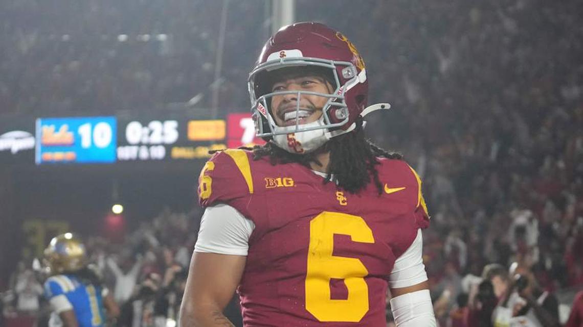  Nov 29, 2025; Los Angeles, California, USA; Southern California Trojans wide receiver Makai Lemon (6) celebrates after catching a 32-yard touchdown pass against the UCLA Bruins in the second half at United Airlines Field at Los Angeles Memorial Coliseum. Mandatory Credit: Kirby Lee-Imagn Images | Kirby Lee-Imagn Images 