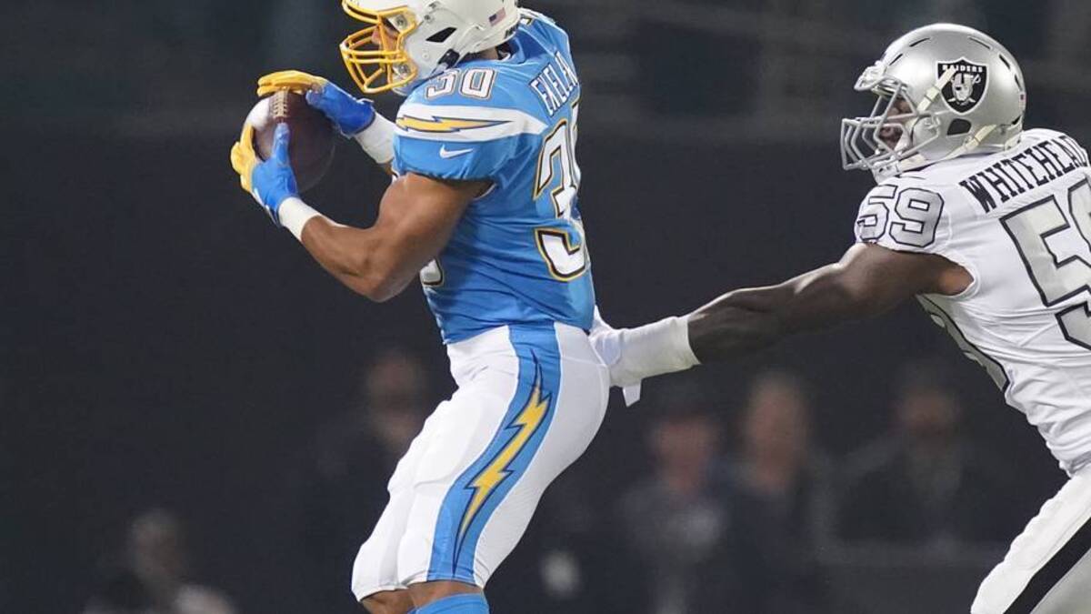  November 7, 2019; Oakland, CA, USA; Los Angeles Chargers running back Austin Ekeler (30) catches a pass against Oakland Raiders outside linebacker Tahir Whitehead (59) during the first quarter at Oakland Coliseum. Mandatory Credit: Kyle Terada-USA TODAY Sports | IMAGN IMAGES via Reuters Connect 