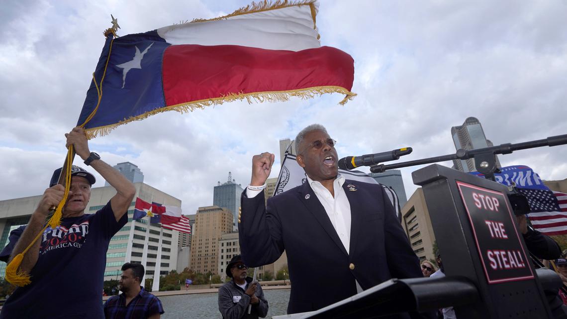 In this Nov. 14, 2020 file photo, Texas GOP chairman Allen West, right, speaks to supporters of President Donald Trump during a rally in front of City Hall in Dallas. West, who is stepping down as chairman effective July 11, announced Sunday he will run for Texas governor.