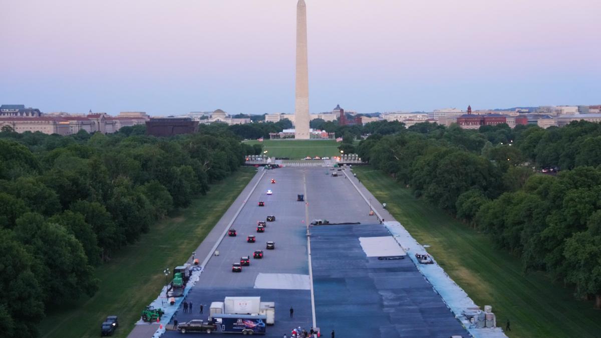 The motorcade with President Donald Trump drives in the Lincoln Memorial Reflecting Pool after a visit to see the new blue protective coating being applied as part of a renovation project on May 7, 2026, in Washington. 