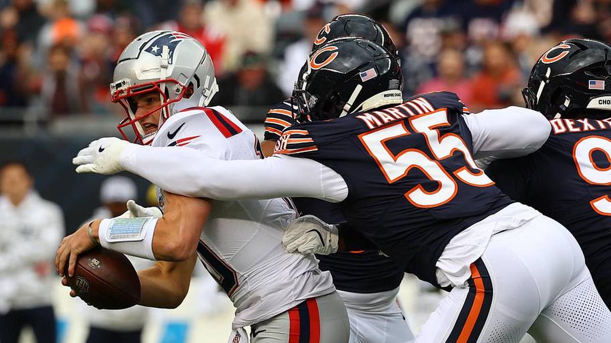 Nov 10, 2024; Chicago, Illinois, USA; Chicago Bears defensive end Jacob Martin (55) sacks New England Patriots quarterback Drake Maye (10) during the first quarter at Soldier Field. Mandatory Credit: Mike Dinovo-Imagn Images | Mike Dinovo-Imagn Images 
