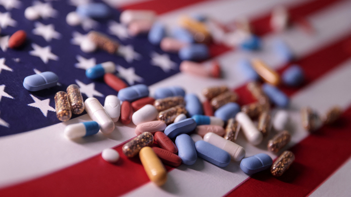 U.S. flag and medicines are seen in this illustration taken, June 27, 2024. REUTERS/Dado Ruvic/Illustration