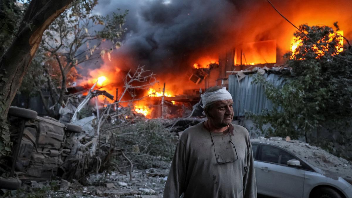 A resident stands at a site of a Russian drone and missile strike, amid Russia's attack on Ukraine, in Kyiv, Ukraine June 2, 2026. REUTERS/Stringer