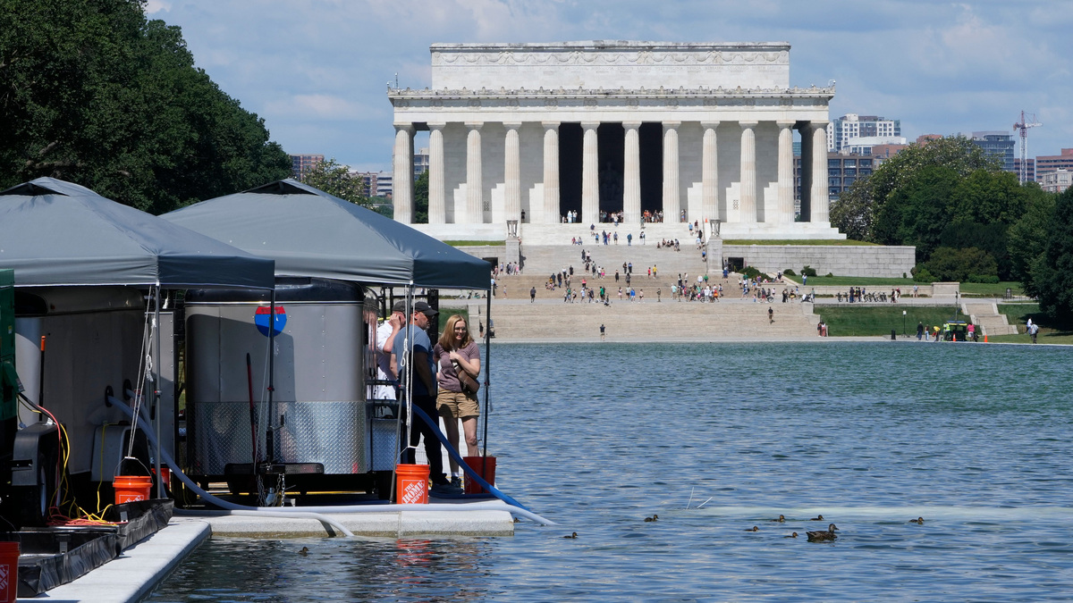 Pumps at the recently renovated Lincoln Memorial Reflecting Pool attempt to clear the green water color on June 15, 2026, in Washington, DC.
