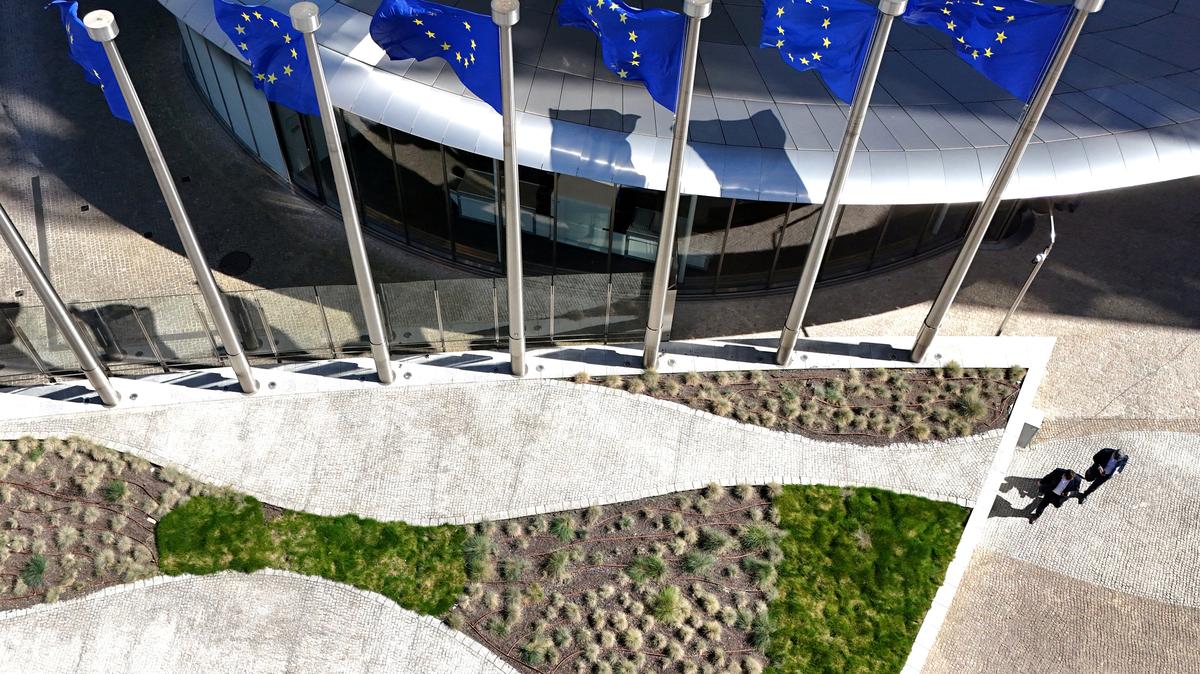 FILE PHOTO: A drone view shows the European Union flags outside the European Commission headquarters, known as the Berlaymont building in Brussels, Belgium, April 29, 2026. REUTERS/Yves Herman/File Photo