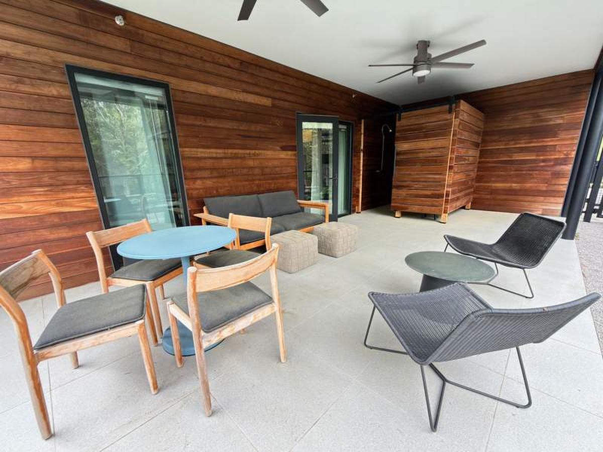  Worth the upgrade: Booking a suite gives you extra living space and access to a private, wooded patio complete with an outdoor shower. Photo credit: Kim Orlando 