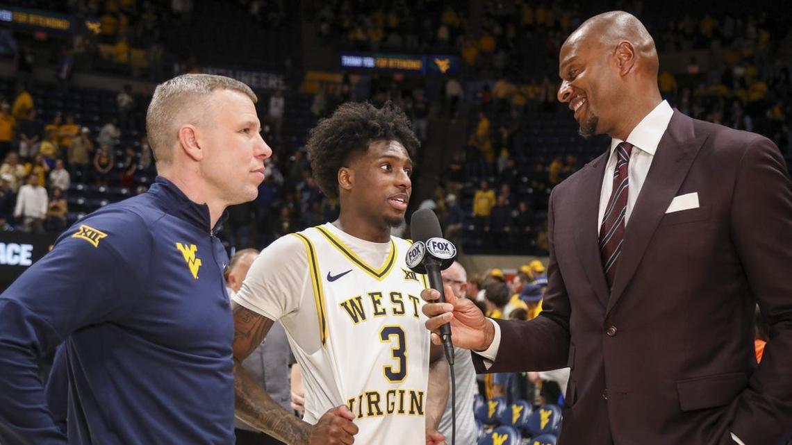 West Virginia rallies, beats Oklahoma in OT to win College Basketball Crown 