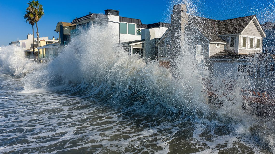Dual tropical storms hit both US coasts with floods and outages 