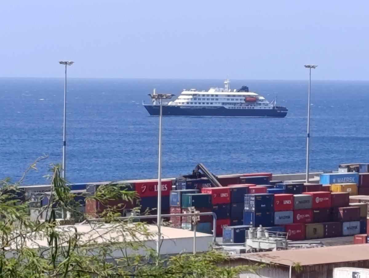 Cruise ship MV Hondius docks off Cape Verde port, as passengers were not allowed off the ship, while health authorities investigated suspected cases of hantavirus aboard the vessel, in Praia Port, Cape Verde, May 4, 2026. Picture taken with a mobile phone. REUTERS/Stringer