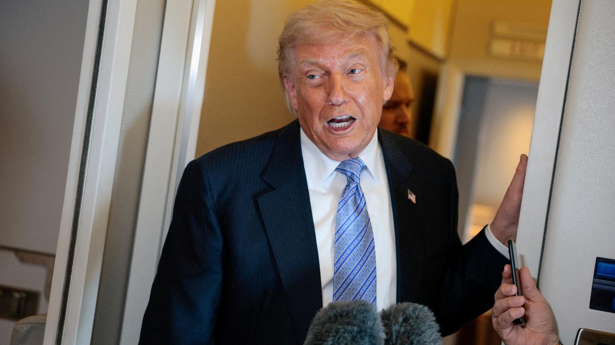 FILE PHOTO: U.S. President Donald Trump speaks to the press aboard Air Force One in China, May 15, 2026. REUTERS/Evan Vucci/File Photo