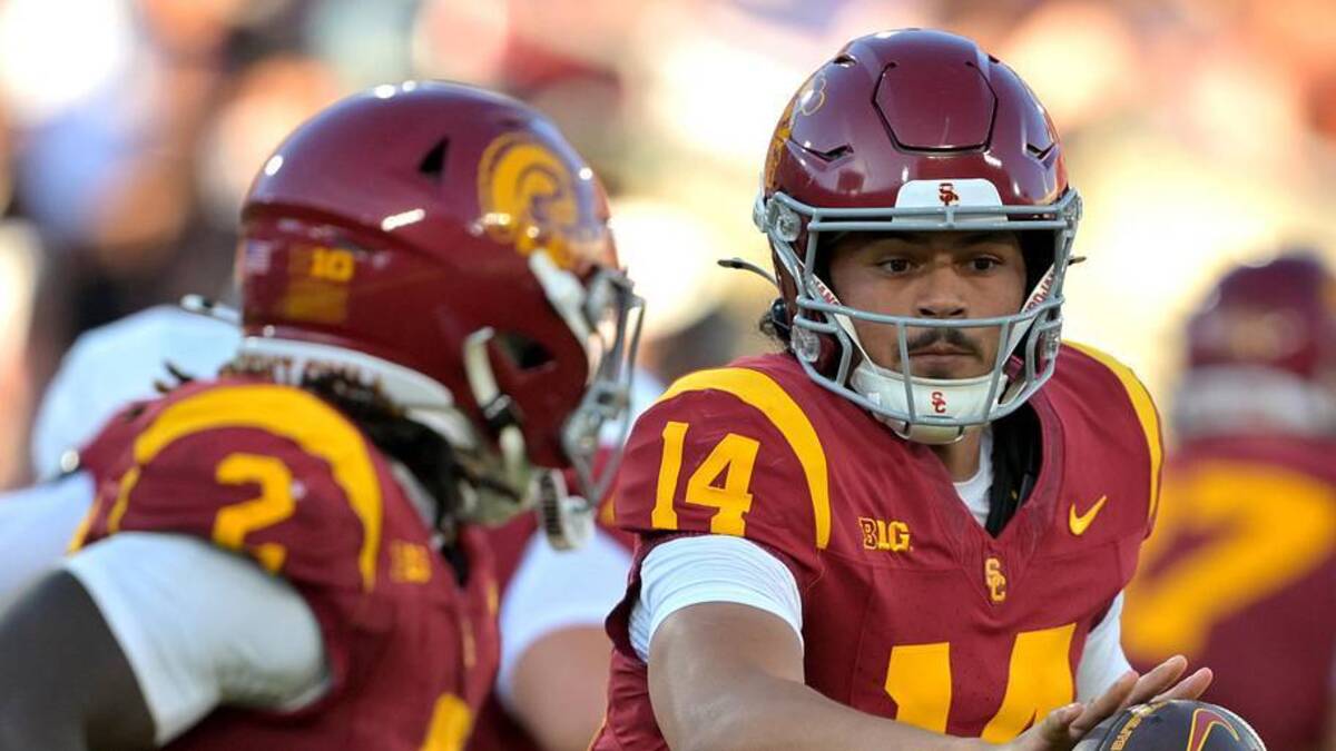  Sep 6, 2025; Los Angeles, California, USA; USC Trojans quarterback Jayden Maiava (14) hands off the ball to running back Waymond Jordan (2) during the first half against the Georgia Southern Eagles at the Los Angeles Memorial Coliseum. Mandatory Credit: Jayne Kamin-Oncea-Imagn Images | Jayne Kamin-Oncea-Imagn Images 
