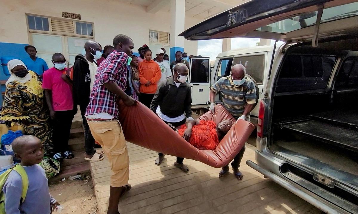 A man is carried from an ambulance as he arrives at Bunia General Referral Hospital following confirmation of an Ebola outbreak involving the Bundibugyo strain in Bunia, Ituri province, Democratic Republic of Congo, May 16, 2026.  Picture taken with a mobile phone. REUTERS/Victoire Mukenge