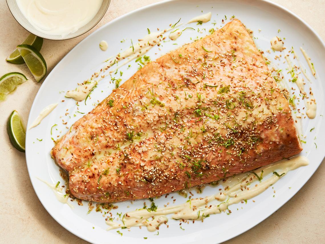 Roasted salmon with miso cream. When you're cooking up salmon for your next dinner, look to something like sour cream or Greek yogurt, which has more acidity than cream cheese and delivers a punch that's similar to a squeeze of lemon. Food styled by Cyd Raftus McDowell. (Armando Rafael/The New York Times)