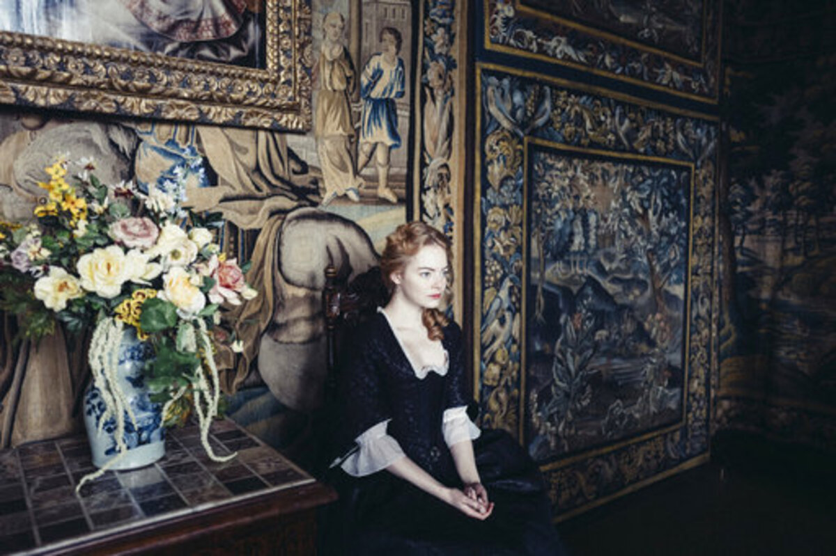 Emma Stone stars in “The Favourite” with Rachel Weisz, a  period piece featuring 18th-century royal intrigue in the court of Queen Anne.
