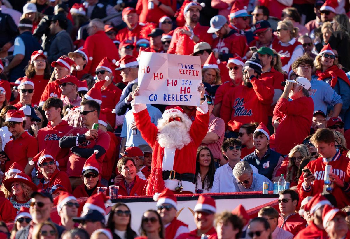  An Ole Miss fan dressed as Santa holds a sign making fun of Lane Kiffin during the first round of the College Football Playoff against Tulane at Vaught-Hemingway Stadium in Oxford, Miss., on Saturday, Dec. 20, 2025. © Lauren Witte/Clarion Ledger / USA TODAY NETWORK via Imagn Images