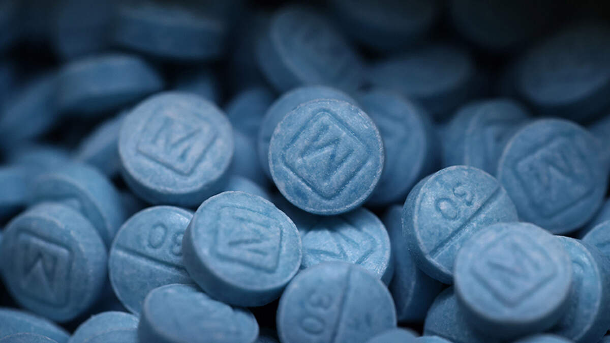 The person who law enforcement authorities allege transferred fentanyl to a 33-year-old man who overdosed and died inside a Fort Worth Subway bathroom has pleaded guilty to manslaughter. Hundreds of seized fentanyl pills that imitate Oxycodone M30 are shown at the Drug Enforcement Administration's Dallas Field Division lab in a 2023 photo.