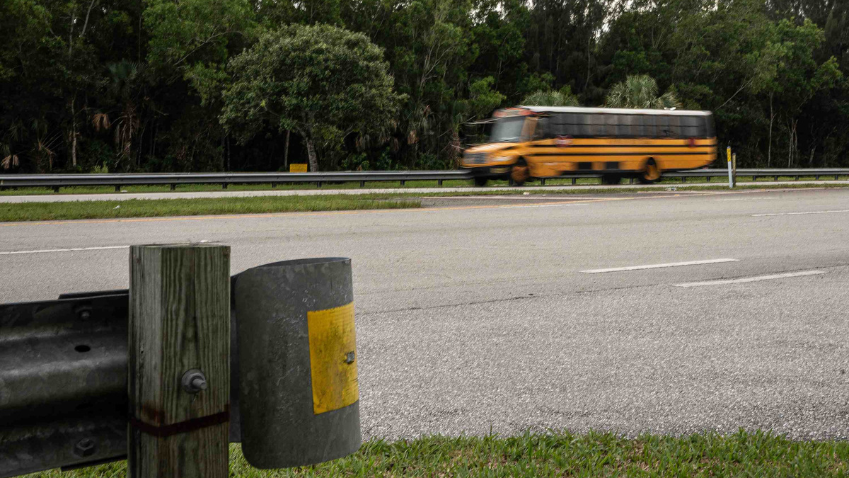 A bus passes the proposed Calvary Chapel Christian School parcel on the south side Indiantown Road in unincorporated Palm Beach County, Fla., on June 25, 2026.