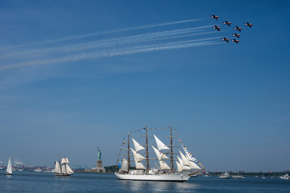 Planes fly overhead as a parade of sailing ships made their way through New York harbor on July 4, 2026. America celebrates the 250th anniversary of its independence today, with people from one end of the country to the other marking the milestone with fireworks, parades and concerts. (Juan Arredondo/The New York Times)