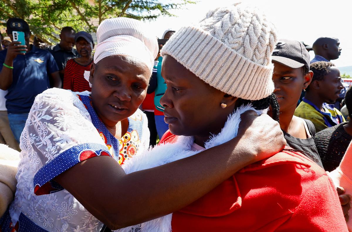 Parents and residents react as they gather at the Utumishi Girls' Academy Senior School following an overnight fire in a dormitory at the facility in Gilgil, Nakuru county, Kenya May 28, 2026. REUTERS/Thomas Mukoya