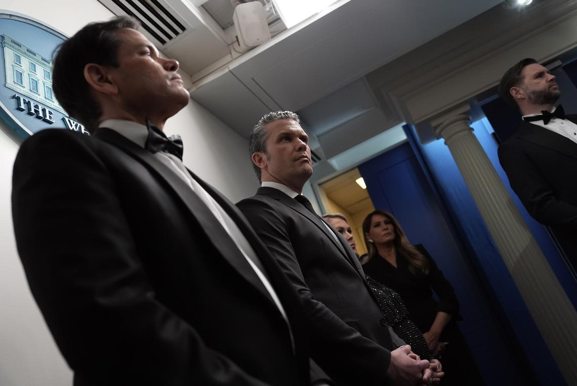 Cabinet secretaries and others look on as President Donald Trump briefs reporters at the White House after shots were fired during the White House Correspondents' Association dinner at the Washington Hilton in Washington on Saturday, April 25, 2026. From left: Secretary of State Marco Rubio. Defense Secretary Pete Hegseth; White House Press Secretary Karoline Leavitt; Melania Trump, the first lady; and Vice President JD Vance. (Salwan Georges/The New York Times)