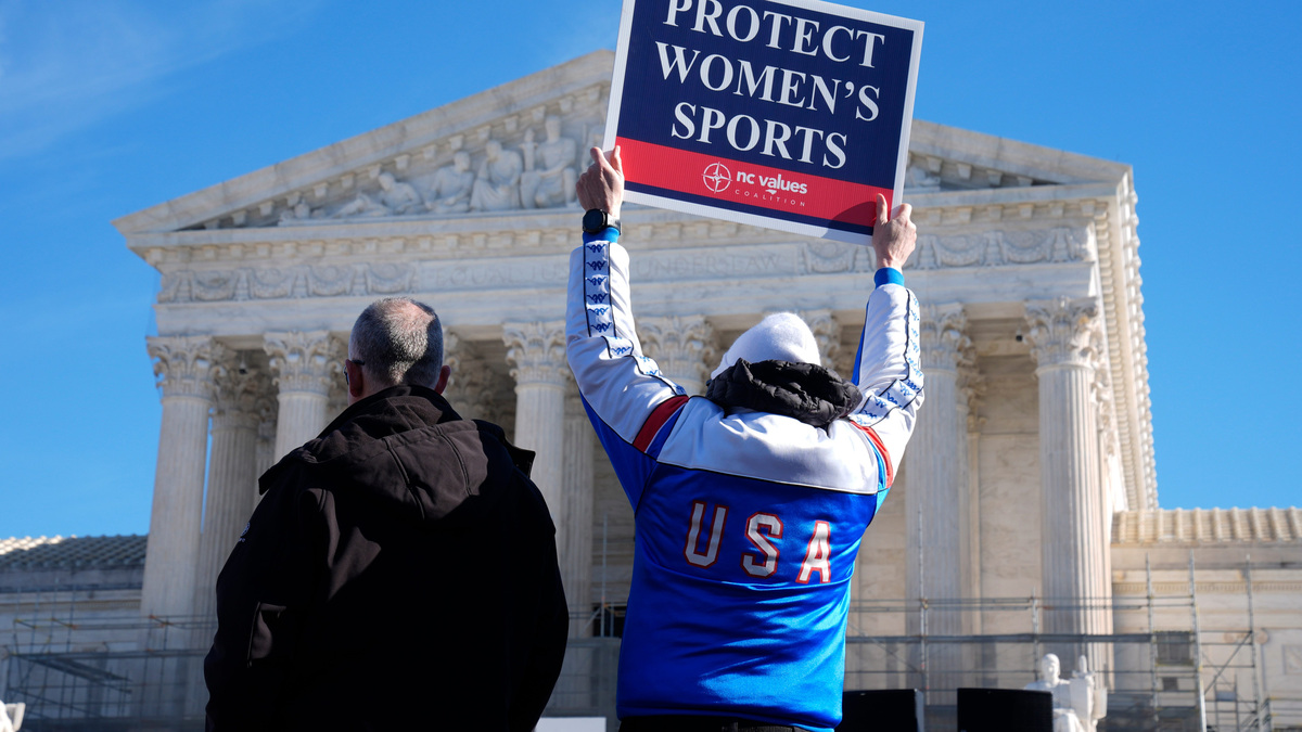 Demonstrators rally outside the Supreme Court in Washington, DC, on Jan. 13, 2026, as the justices hear oral arguments in two cases related to transgender athlete participation in sports.