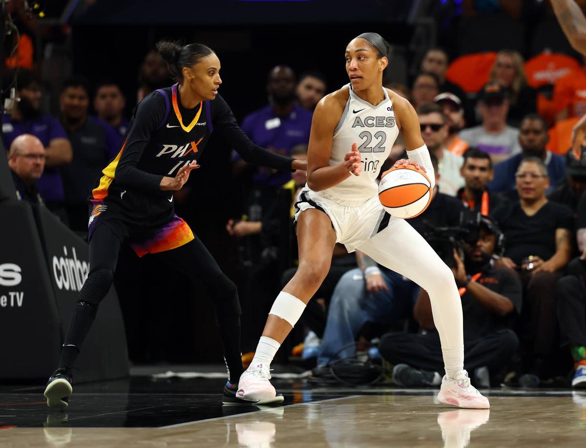  Las Vegas Aces center A'ja Wilson operates with the ball as Phoenix Mercury forward DeWanna Bonner defends during Game 3 of the WNBA Finals in Phoenix on Oct. 8, 2025. Mark J. Rebilas-Imagn Images