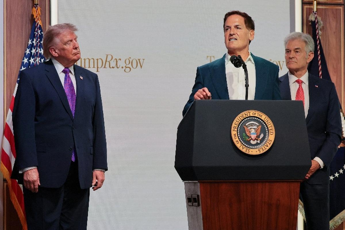 Centre for Medicare & Medicaid Services Administrator Dr Mehmet Oz and U.S. President Donald Trump listen as Mark Cuban speaks during an event to deliver remarks about health care costs and affordability from an auditorium on the White House campus in Washington, D.C., U.S., May 18, 2026. REUTERS/Jonathan Ernst