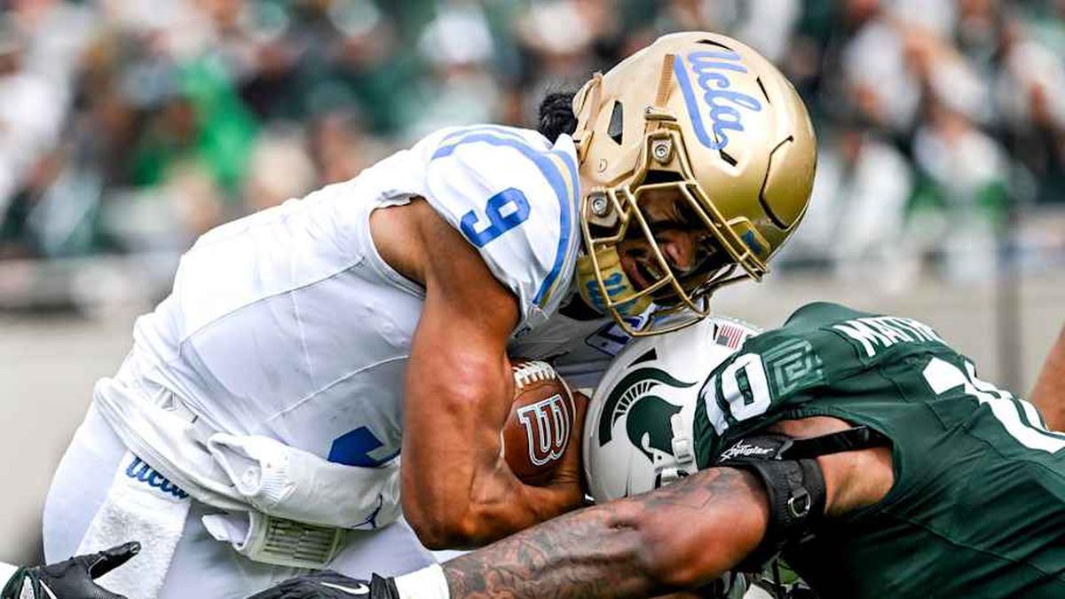  Michigan State's Wayne Matthews III, right, tackles UCLA's Nico Iamaleava during the second quarter on Saturday, Oct. 11, 2025, at Spartan Stadium in East Lansing. | Nick King/Lansing State Journal / USA TODAY NETWORK via Imagn Images 