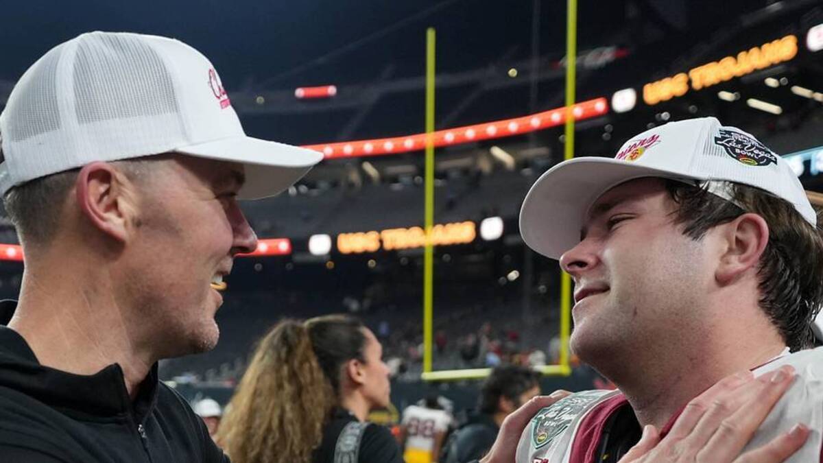  Dec 27, 2024; Las Vegas, NV, USA; Southern California Trojans head coach Lincoln Riley embraces offensive lineman Kilian O'Connor (67) after the game against the Texas A&M Aggies at Allegiant Stadium. Mandatory Credit: Kirby Lee-Imagn Images | Kirby Lee-Imagn Images 