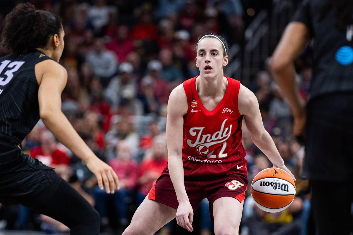  May 22, 2026; Indianapolis, Indiana, USA; Indiana Fever guard Caitlin Clark (22) dribbles the ball while Golden State Valkyries forward Janelle Salaun (13) defends in the second half at Gainbridge Fieldhouse. Mandatory Credit: Trevor Ruszkowski-Imagn Images 