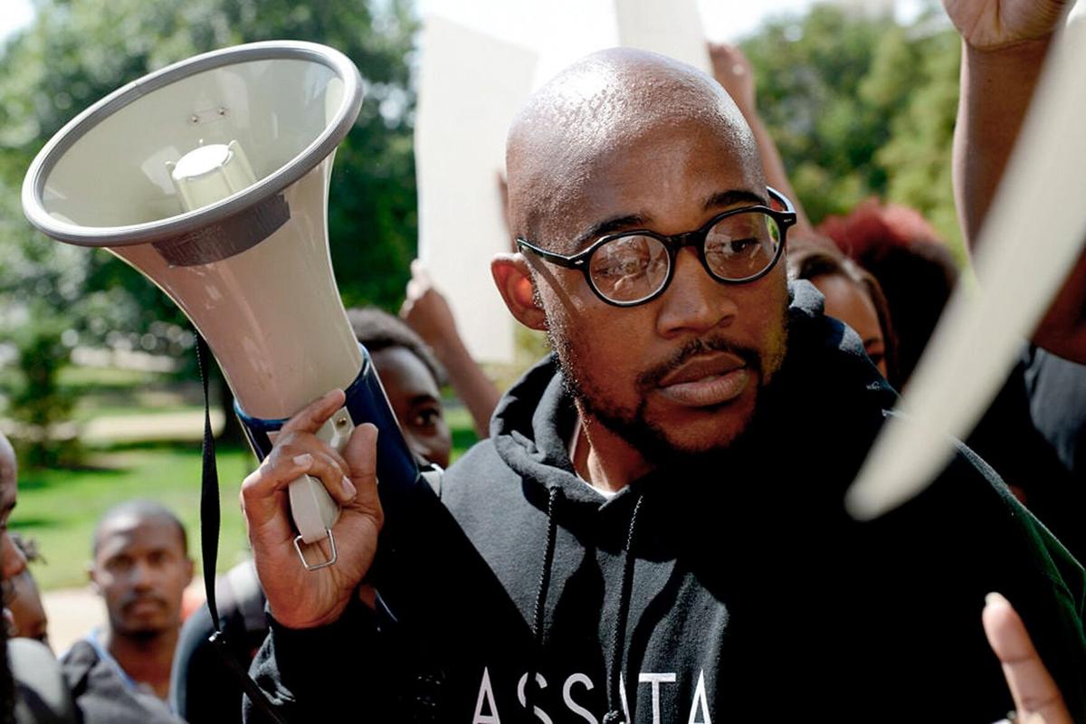 Jonathan Butler talks with people at a Racism Lives Here protest on Sept. 24, 2015, at the University of Missouri. In the next few weeks, in a personal letter to the UM System Board of Curators, Butler announced he would go on a hunger strike until Tim Wolfe was no longer UM System president.