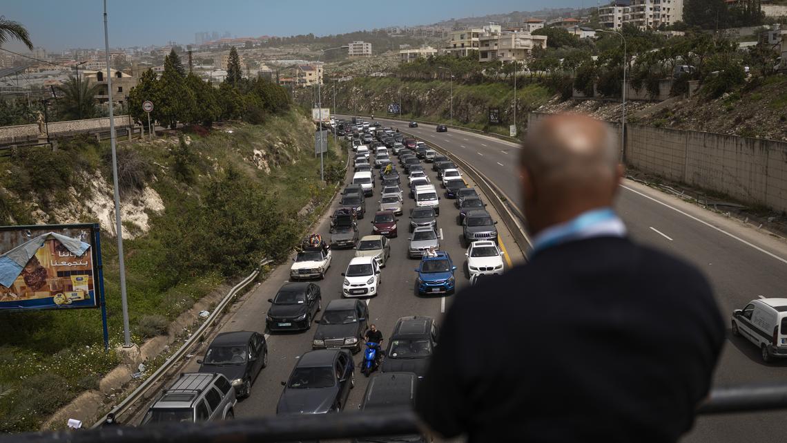 A Lebanese family returning south on the Beirut to Sidon coastal highway, on the second day of the ceasefire, Saturday, April 18. Prime Minister Benjamin Netanyahu said Israeli troops would remain inside Lebanon, as part of what he called an "expanded security zone" from Lebanon's Mediterranean coast to its border with Syria, south of the Litani River.