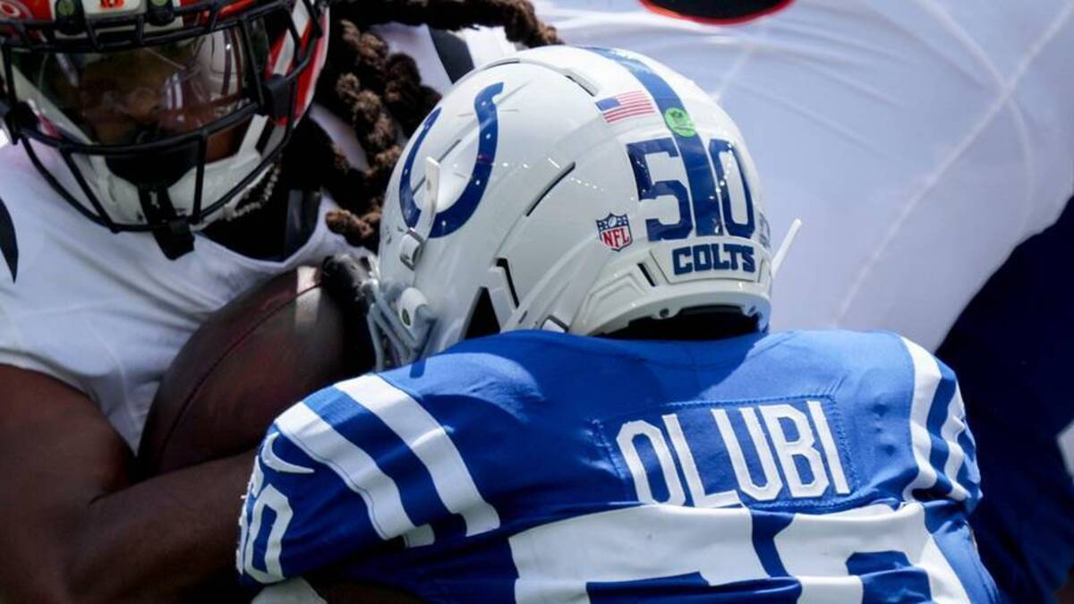  Indianapolis Colts linebacker Segun Olubi (50) works to bring down Cincinnati Bengals running back Gary Brightwell (32) on Saturday, Aug. 23, 2025, during a game against the Cincinnati Bengals at Paycor Stadium in Cincinnati. | Grace Hollars/IndyStar / USA TODAY NETWORK via Imagn Images 