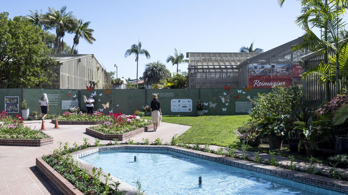 People walk the grounds as demolition has begun, behind fence, for the renovation of Sherman Library & Gardens in Corona del Mar, CA on Tuesday, April 7, 2026. (Photo by Paul Bersebach, Orange County Register/SCNG)