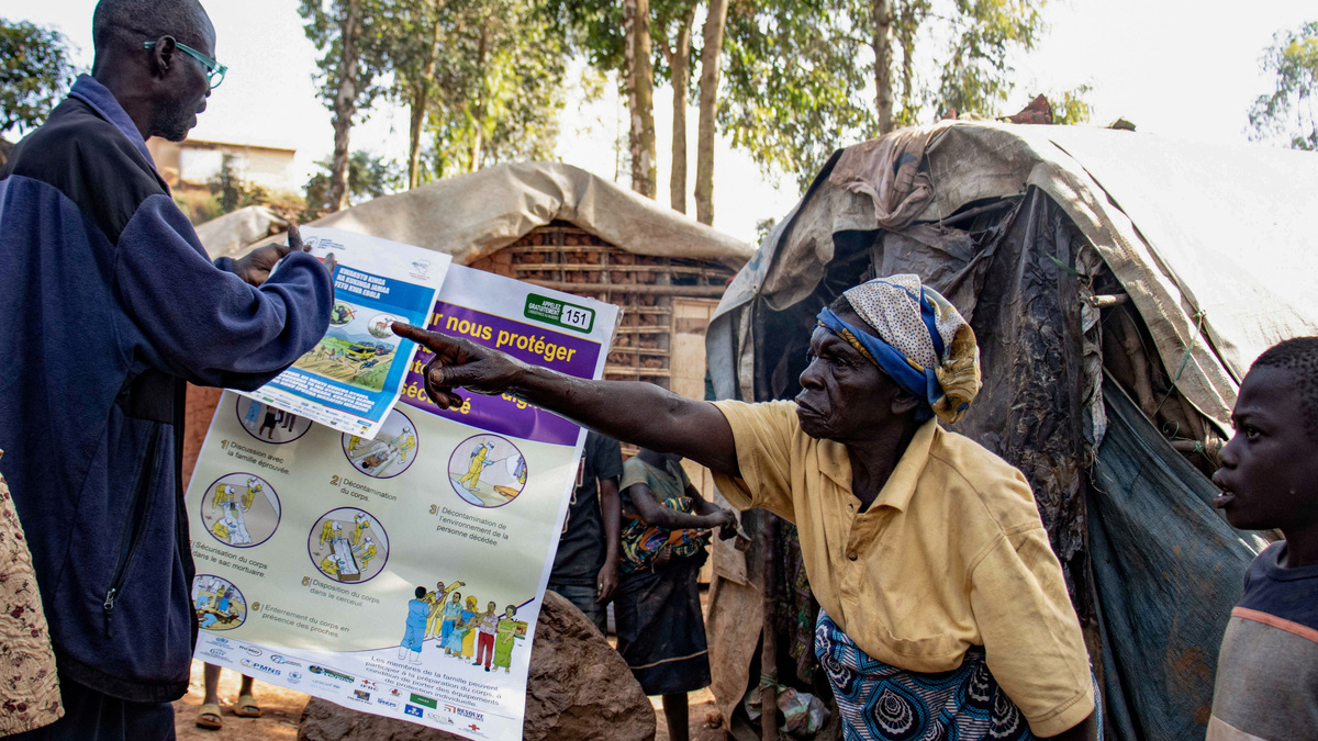 A displaced woman reacts during an Ebola awareness session as humanitarian agencies intensify efforts to contain a new Ebola outbreak involving the Bundibugyo strain, at Kpangba displacement camp where Ebola cases were observed, Djugu territory in Ituri province, Democratic Republic of Congo, June 13, 2026. REUTERS/Gradel Muyisa Mumbere.