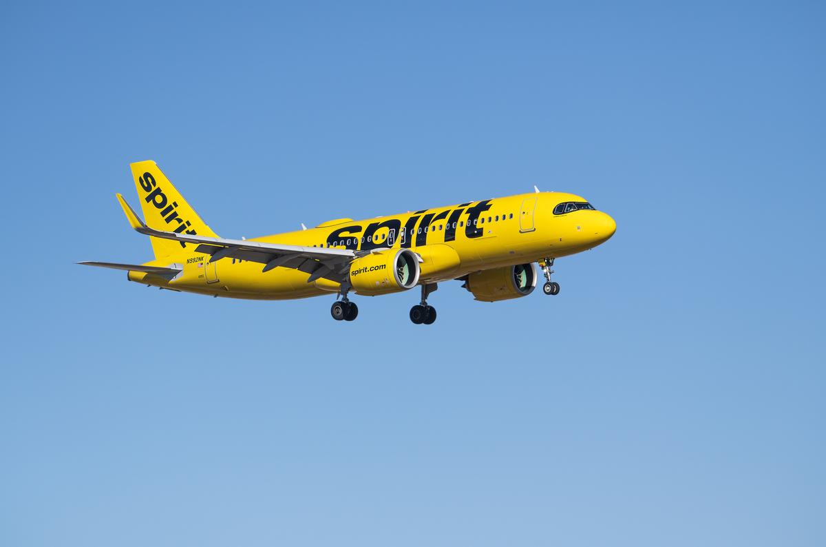  Spirit Airlines aircraft Airbus A320-271N airborne over Dallas Fort Worth International Airport (DFW), blue skies. 