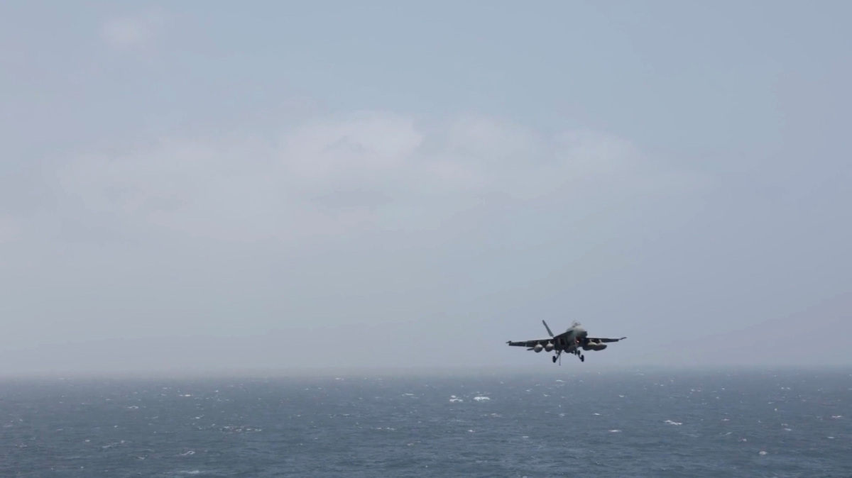 An aircraft prepares to land aboard the USS George H.W. Bush, at an unknown location, released July 14, 2026, in this still image taken from a handout video. U.S. Central Command (CENTCOM)/Handout via REUTERS