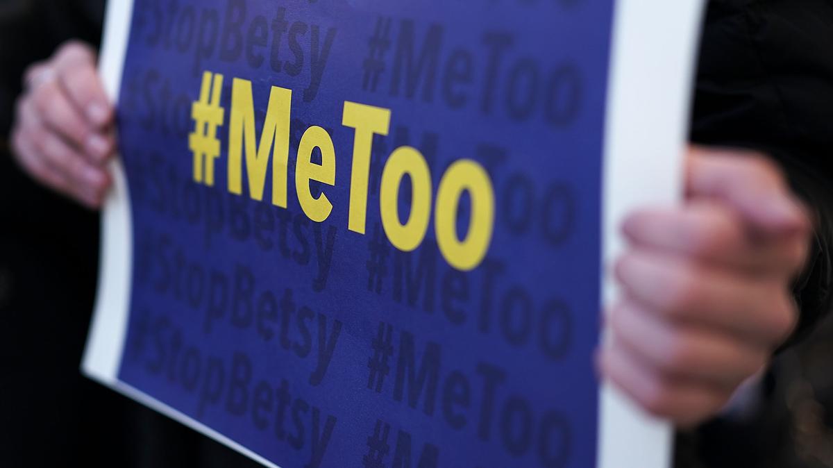 An activist holds a #MeToo sign during a news conference on a Title IX lawsuit outside the Department of Education Jan. 25, 2018, in Washington, D.C.  (Alex Wong/Getty Image/TNS)