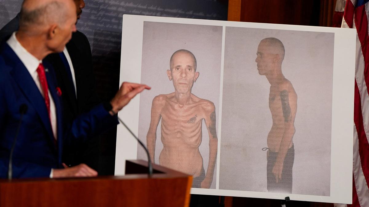U.S. Senator Rick Scott (R-FL) points to a poster with images of Alexander Diaz Rodriguez, a Cuban released last April after serving a five-year sentence in a Cuban prison, during a press conference on Cuba and the U.S. indictment of former Cuban President Raúl Castro, at the U.S. Capitol in Washington, D.C., U.S., May 20, 2026. REUTERS/Elizabeth Frantz