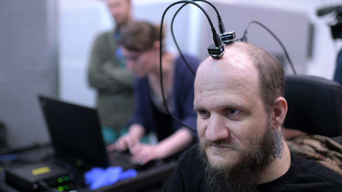 Brandon Patterson, a 41-year-old who is paralyzed from the chest down and has limited use of his arms, gets a post-surgery checkup for his implanted brain-computer interface at the University of Colorado's Anschutz Medical Campus in Aurora on April 10, 2026. (Hyoung Chang/The Denver Post/TNS)