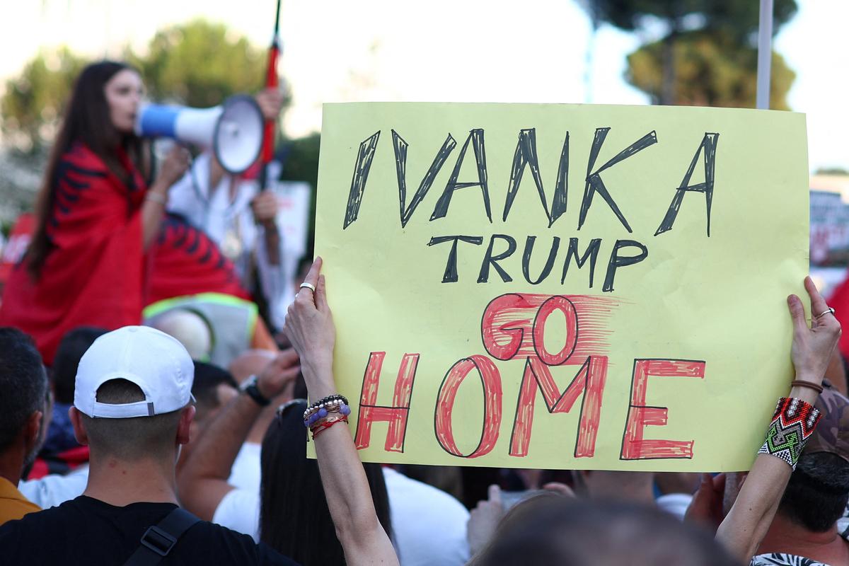 Demonstrators holds banners as they protest against a luxury resort a plan by a company linked with Donald Trump's son-in-law Jared Kushner in a protected area, in Tirana , Albania, June 2, 2026. REUTERS/Florion Goga