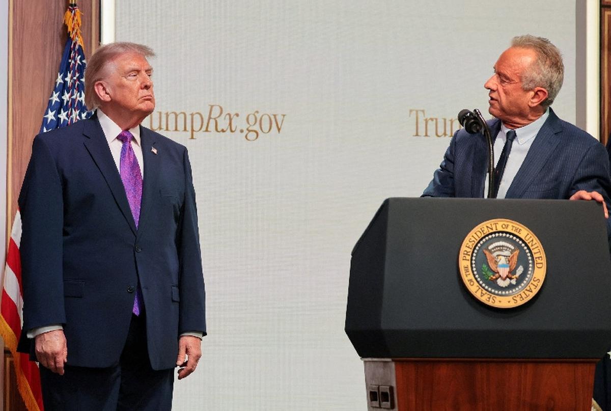 U.S. President Donald Trump looks at U.S. Health and Human Services Secretary Robert F. Kennedy Jr. during an event to deliver remarks about health care costs and affordability from an auditorium on the White House campus in Washington, D.C., U.S., May 18, 2026. REUTERS/Jonathan Ernst