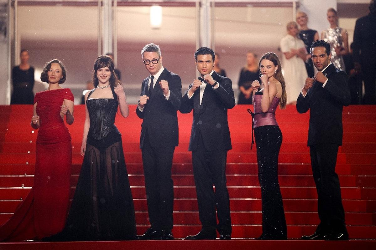 Director Nicolas Winding Refn, cast members Sophie Thatcher, Diego Calva, Kristine Froseth, Charles Melton and Havana Rose Liu pose on the red carpet during arrivals for the screening of the film "Her Private Hell" Out of competition at the 79th Cannes Film Festival in Cannes, France, May 18, 2026. REUTERS/Marko Djurica