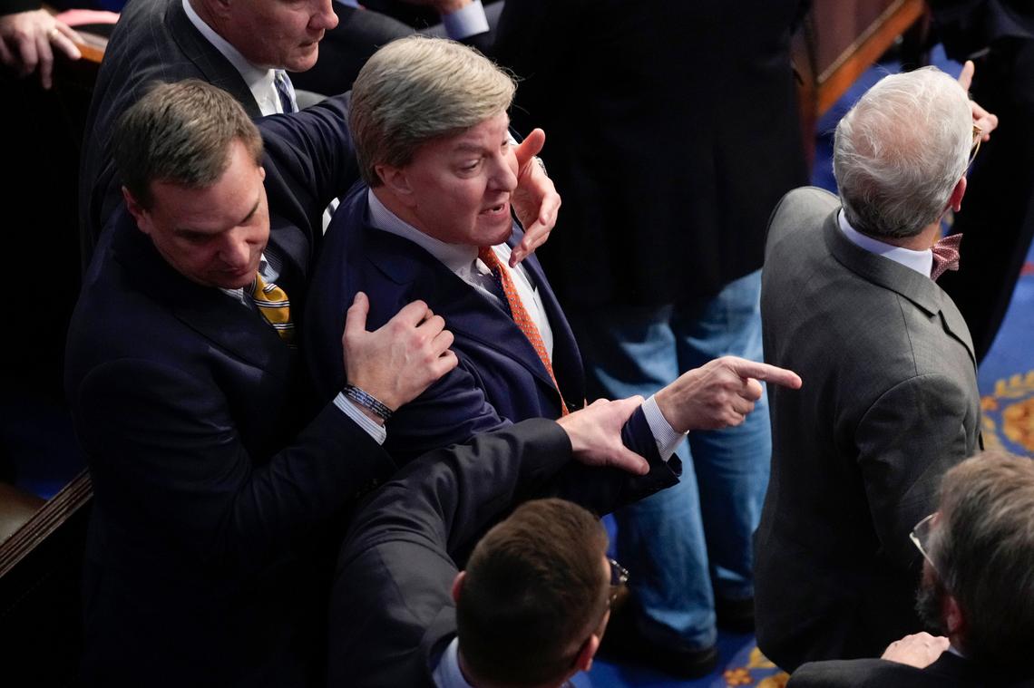 Rep. Richard Hudson, R-N.C., left, pulls Rep. Mike Rogers, R-Ala., back as they talk with Rep. Matt Gaetz, R-Fla., and other during the 14th round of voting for speaker as the House meets for the fourth day to try and elect a speaker and convene the 118th Congress in Washington, Friday, Jan. 6, 2023.