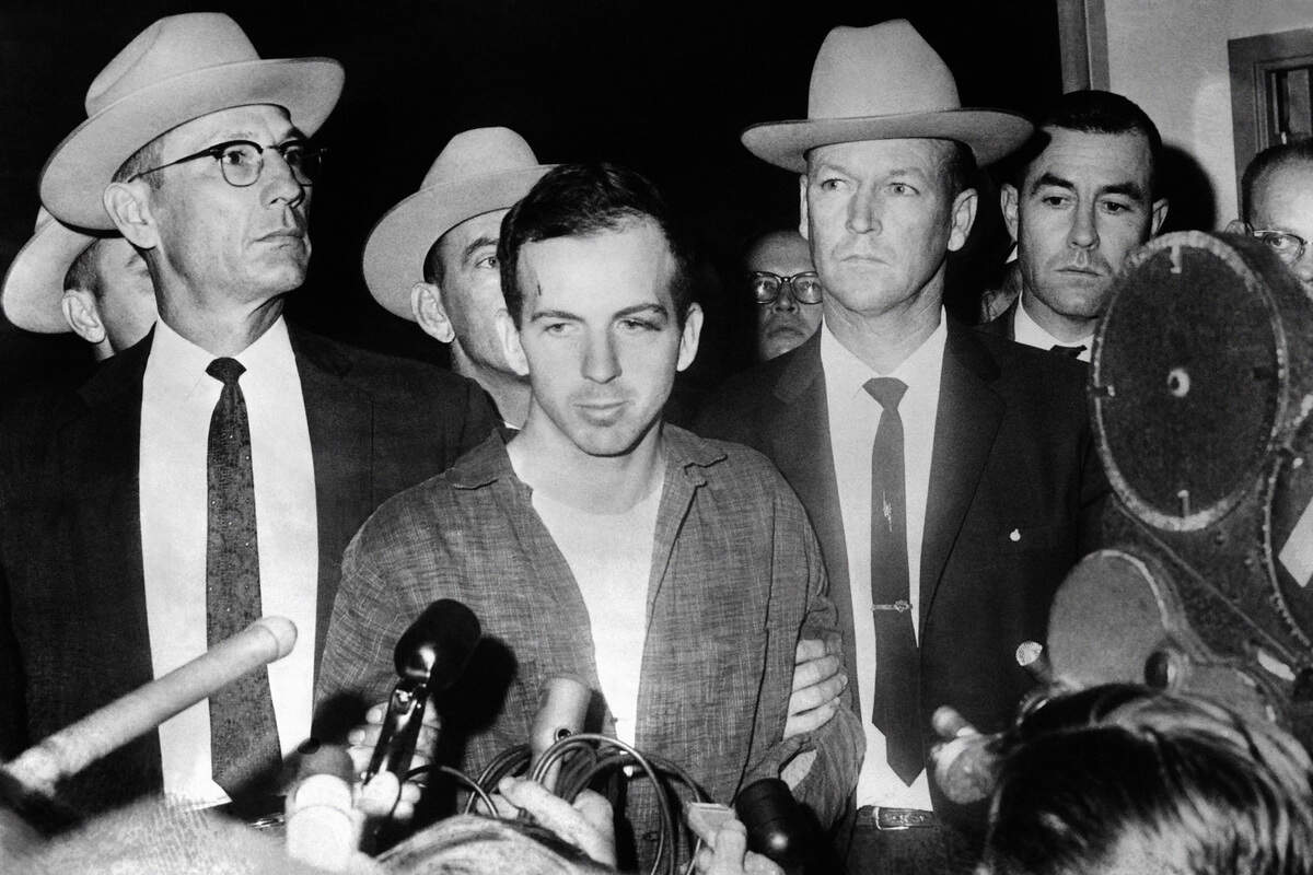 John F. Kennedy’s murderer Lee Harvey Oswald during a Nov. 22, 1963, press conference after his arrest in Dallas. Oswald was killed by Jack Ruby on Nov. 24 on the eve of Kennedy’s burial. (Stringer/AFP/Getty Images/TNS)