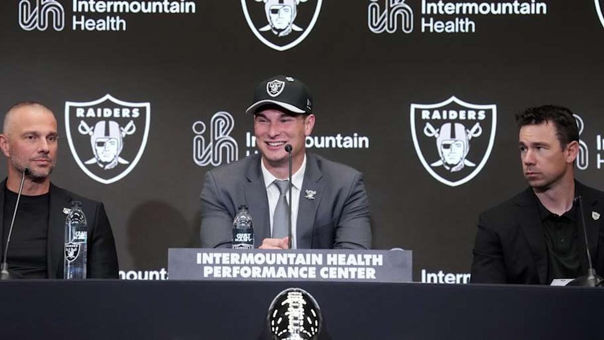  Apr 24, 2026; Henderson, NV, USA; Las Vegas Raiders quarterback Fernando Mendoza (center) speaks at introductory press conference at Intermountain Health Performance Center flanked by general manager John Spytek (left) and head coach Klint Kubiak after being selected as the No. 1 pick in the 2026 NFL Draft. Mandatory Credit: Kirby Lee-Imagn Images | Kirby Lee-Imagn Images 