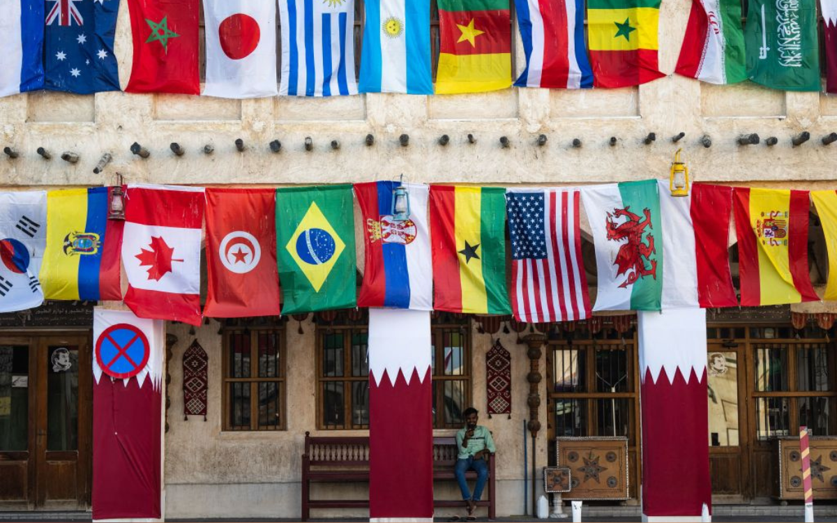  A man rests at a bench near the Souq Waqif marketplace in Doha on November 17, 2022, ahead of the Qatar 2022 World Cup football tournament. 