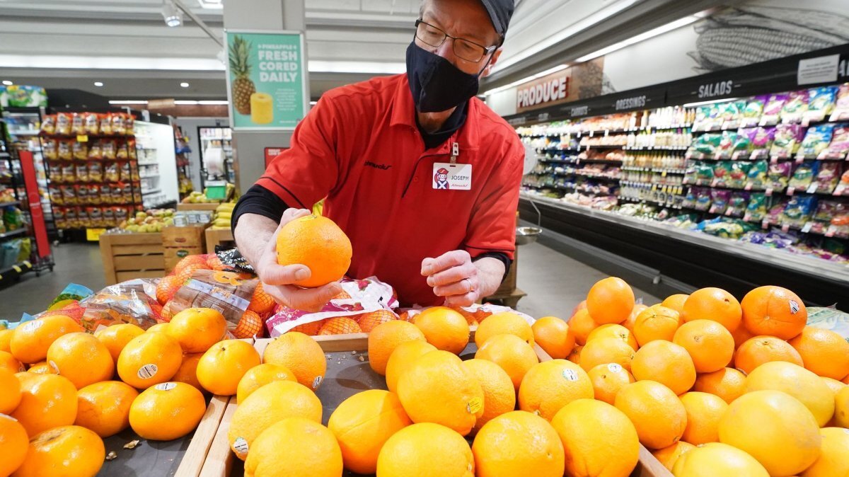 Employee Joseph Hayes checks the color of a batch of oranges he has placed for sale at Schnucks Markets in Ladue, Mo., on Jan. 26, 2022. The United States added 172,000 nonfarm payrolls in May, more than doubling expectations, the Bureau of Labor Statistics reported Friday.
File Photo by Bill Greenblatt/UPI