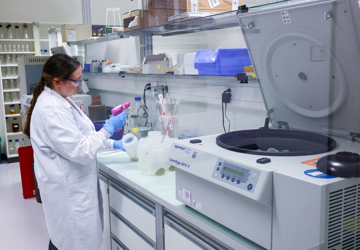A staff member works in the expression laboratory at Molecular Partners, a biotech company specialising in custom‑built DARPin therapeutics, ahead of a June 14 vote on a plan backed by the right‑wing party to limit population growth to 10 million inhabitants, in Schlieren near Zurich, Switzerland, May 28, 2026. Picture taken through a window. REUTERS/Denis Balibouse