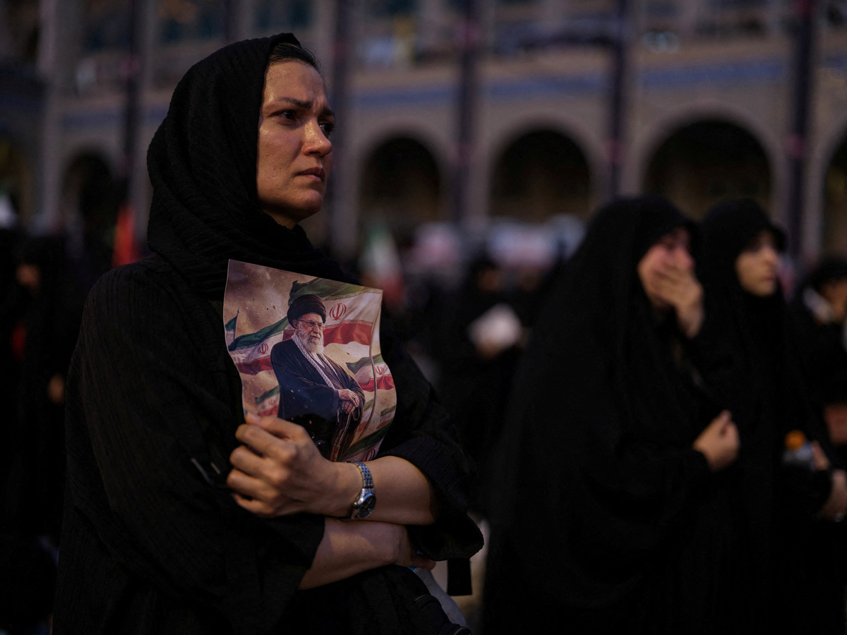 A mourner holds a portrait of late Supreme Leader Ayatollah Ali Khamenei, who was killed on February 28 in Israeli and U.S. airstrikes,  during a public farewell ceremony to pay their respects, at the Imam Khomeini Grand Mosalla, in Tehran, Iran July 4, 2026. REUTERS/Mohammed Salem Foreign media in Iran operate under guidelines set by the Ministry of Culture and Islamic Guidance, which regulates press activity and permissions